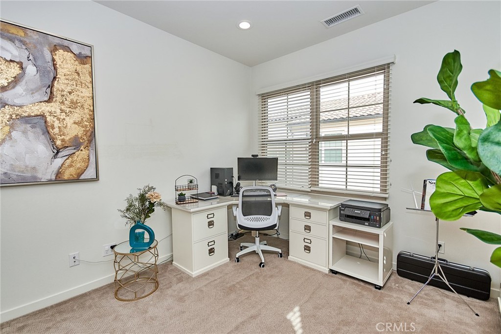 129 Excursion Irvine, CA 92618 - Photo 19 of 53 a view of a workspace with furniture and a window