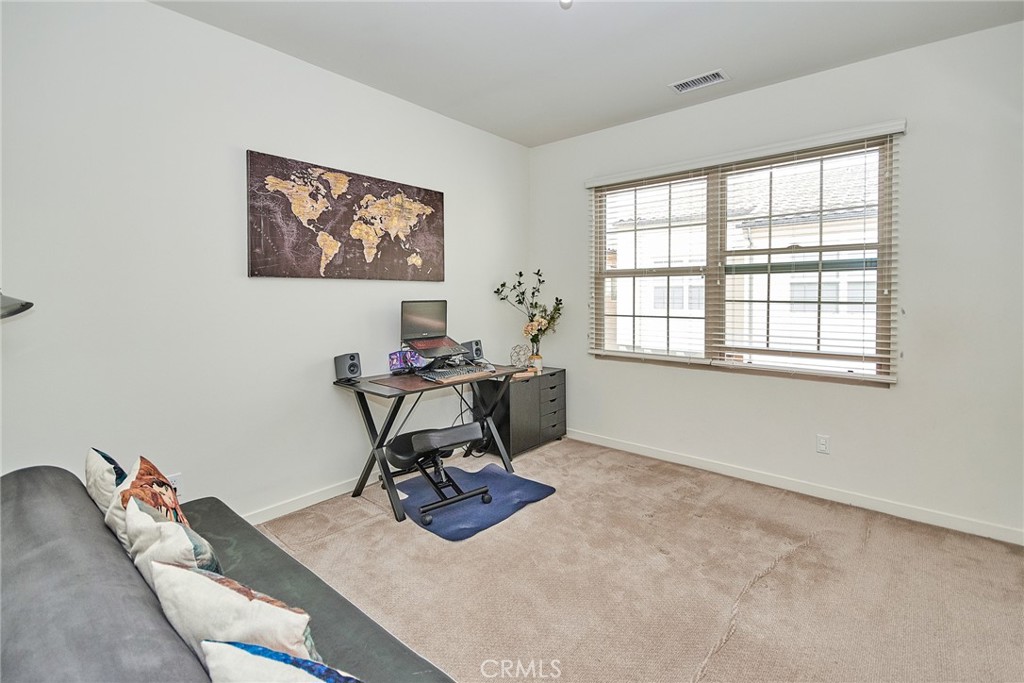 129 Excursion Irvine, CA 92618 - Photo 22 of 53 a workspace with furniture and a window