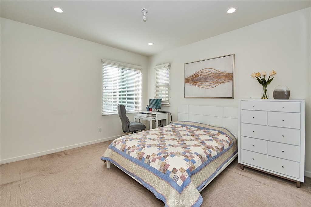 129 Excursion Irvine, CA 92618 - Photo 29 of 53 a bedroom with a bed and window