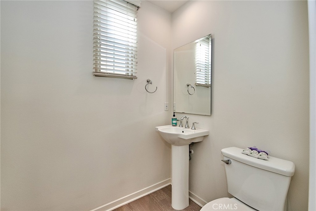 129 Excursion Irvine, CA 92618 - Photo 35 of 53 a bathroom with a toilet sink and mirror