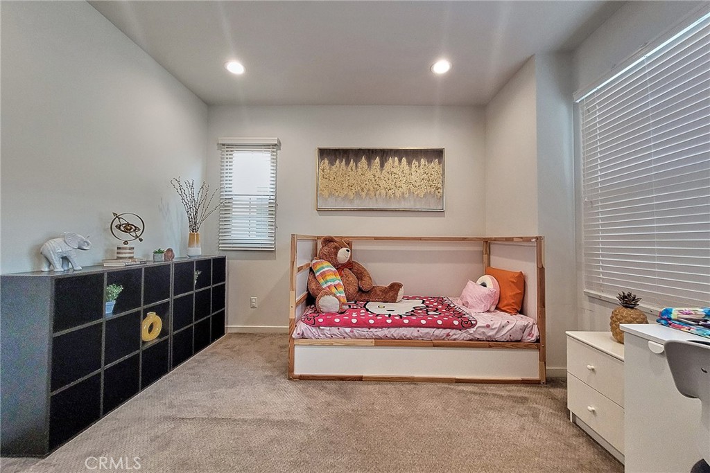 129 Excursion Irvine, CA 92618 - Photo 37 of 53 a bed room with furniture and book shelf