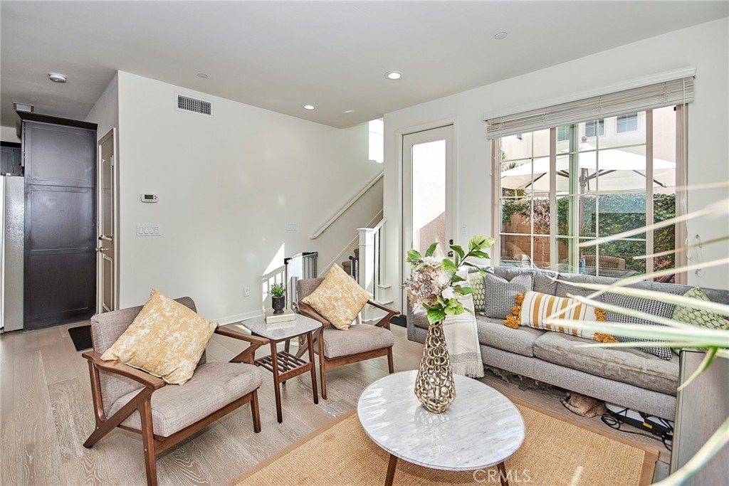 129 Excursion Irvine, CA 92618 - Photo 38 of 53 a living room with furniture and a large window