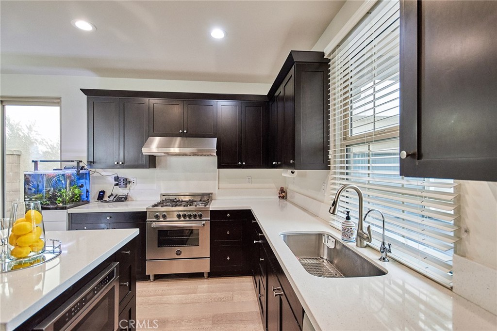 129 Excursion Irvine, CA 92618 - Photo 4 of 53 a kitchen that has a sink and a stove