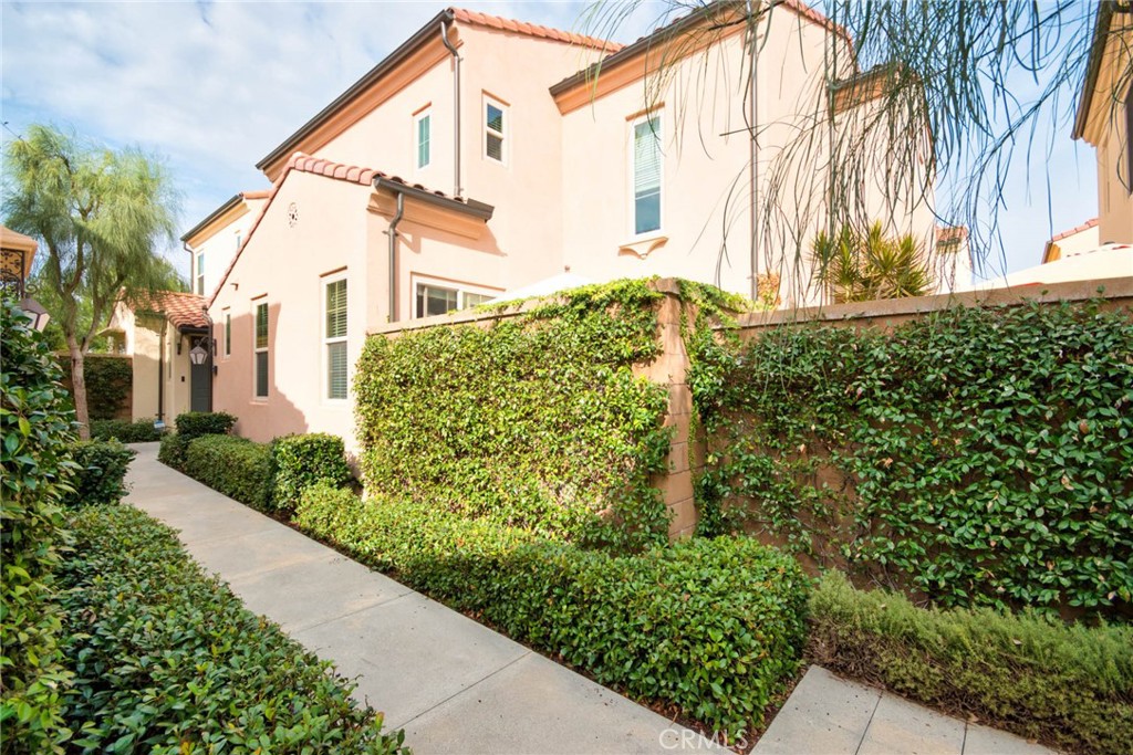 129 Excursion Irvine, CA 92618 - Photo 42 of 53 a view of a house with a yard and plants