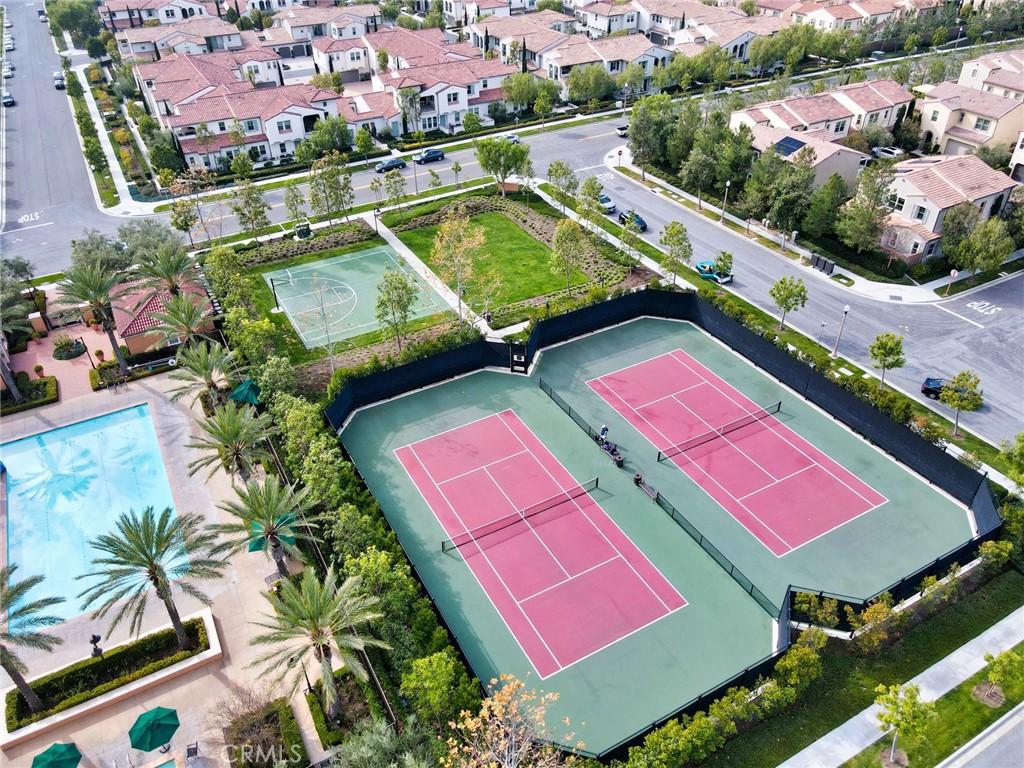 129 Excursion Irvine, CA 92618 - Photo 51 of 53 an aerial view of a tennis ground and a houses