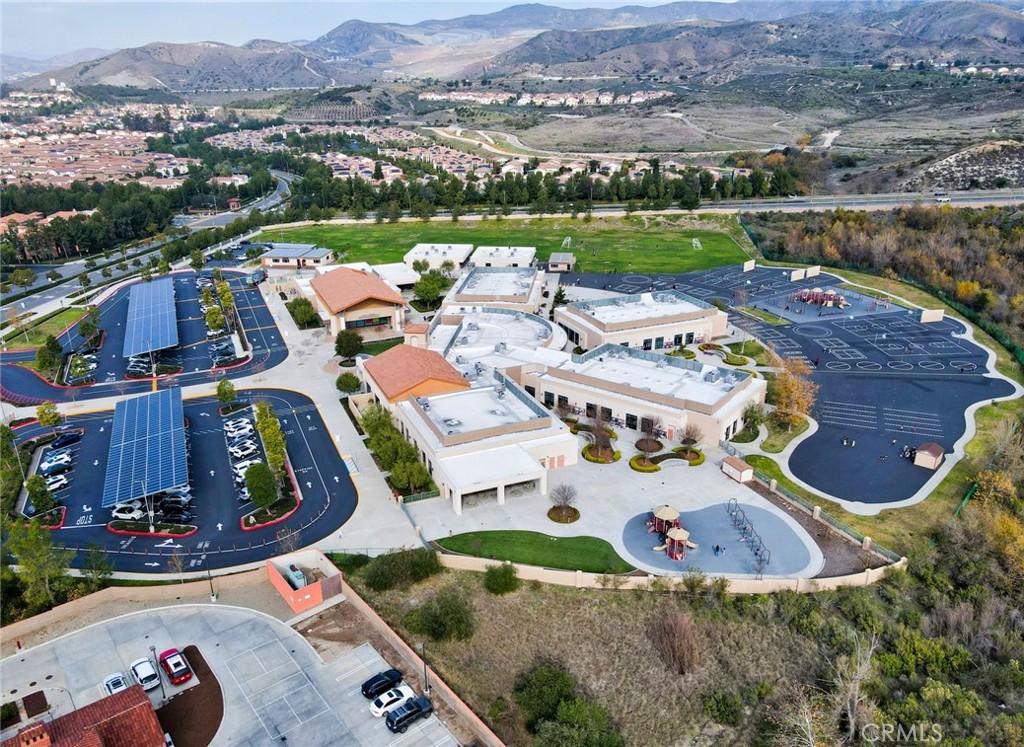 129 Excursion Irvine, CA 92618 - Photo 52 of 53 an aerial view of a house with a garden