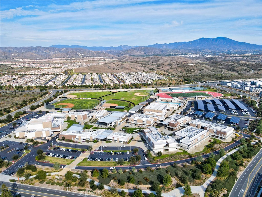 129 Excursion Irvine, CA 92618 - Photo 53 of 53 a picture of city view with lots of residential buildings and mountain view in back