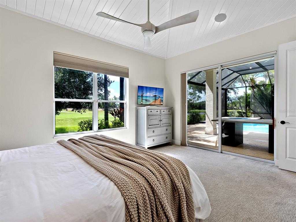 7431 Greystone Street Lakewood Ranch, FL 34202 - Photo 49 of 85 a spacious bedroom with a large bed and a large window