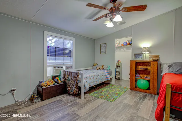 a bathroom with a sink a toilet a mirror a bathtub and shower