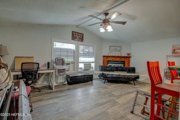 a dining room with furniture and window
