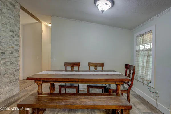 a kitchen with kitchen island granite countertop a sink cabinets and stainless steel appliances