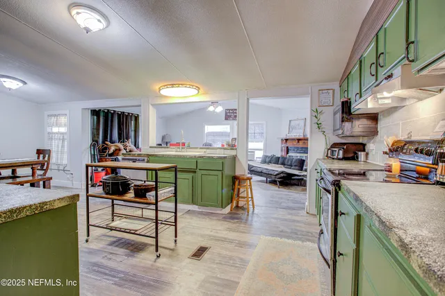 a view of walk in closet with clothes
