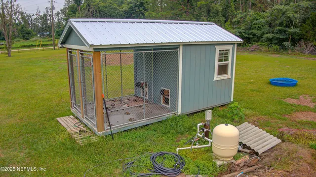 swimming pool view with a seating space