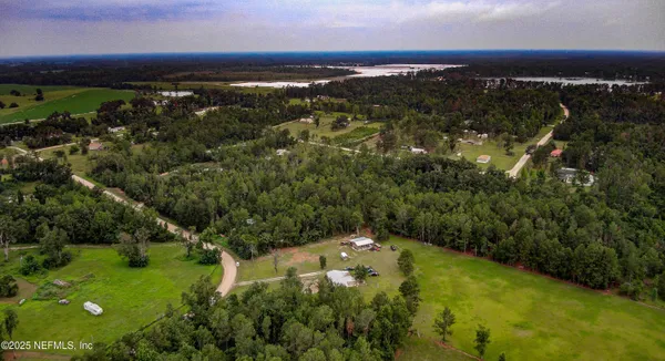 a view of a lake with a yard