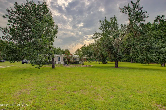 a house with a trees in the background