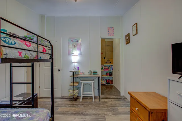 a room with furniture and flat screen tv