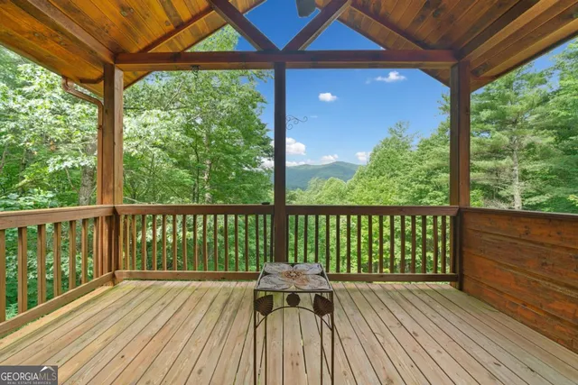 a view of balcony with wooden floor