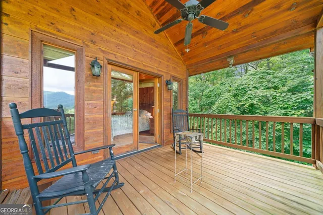 a balcony with wooden floor and outdoor space