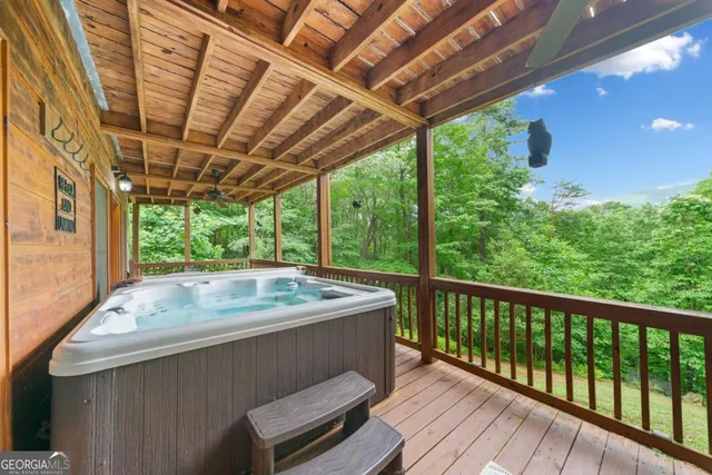 a view of a wooden deck next to a yard