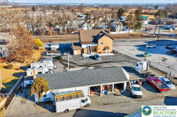 an aerial view of a house with outdoor space
