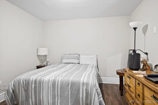 a bedroom with a bed and a table