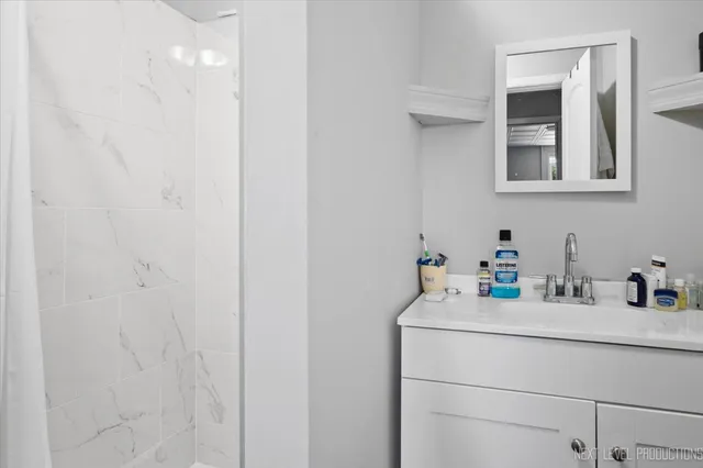 a bathroom with a sink and a mirror