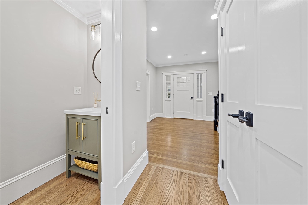 53 Highland Avenue Arlington, MA 02476 - Photo 14 of 34 a view of a room with wooden floor and ceiling fan
