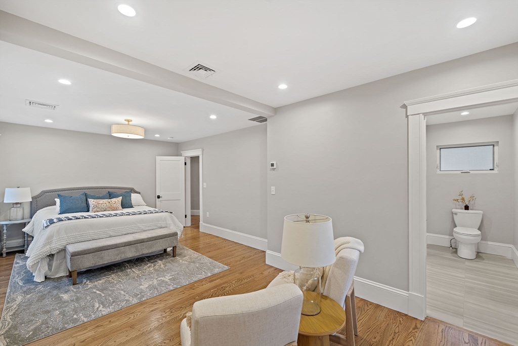 53 Highland Avenue Arlington, MA 02476 - Photo 18 of 34 a spacious bedroom with a bed and furniture
