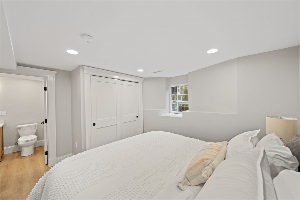 53 Highland Avenue Arlington, MA 02476 - Photo 26 of 34 a bedroom with a bed and a couch