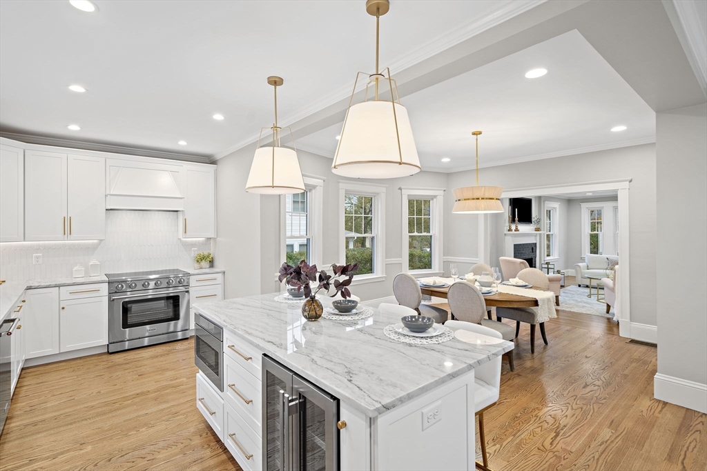 53 Highland Avenue Arlington, MA 02476 - Photo 8 of 34 a open kitchen with stainless steel appliances granite countertop a stove and refrigerator