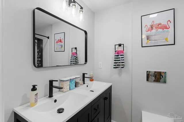 a bathroom with a sink and a mirror