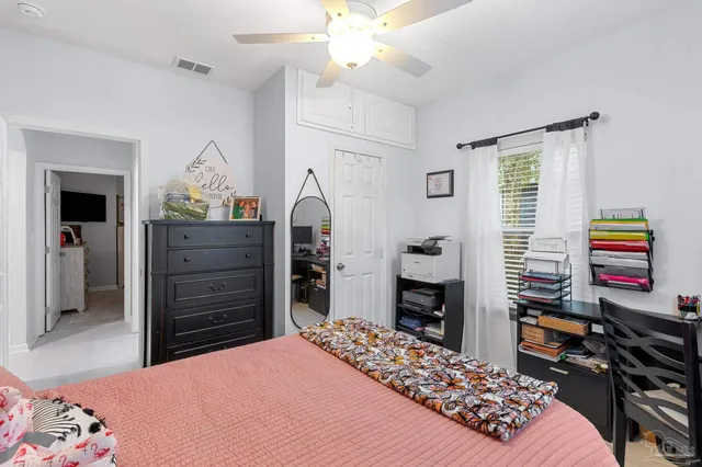 a bedroom with a bed and a fireplace