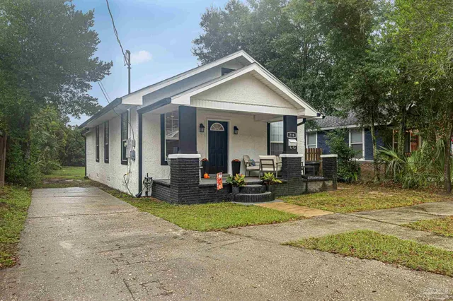 a view of a house with outdoor space and porch
