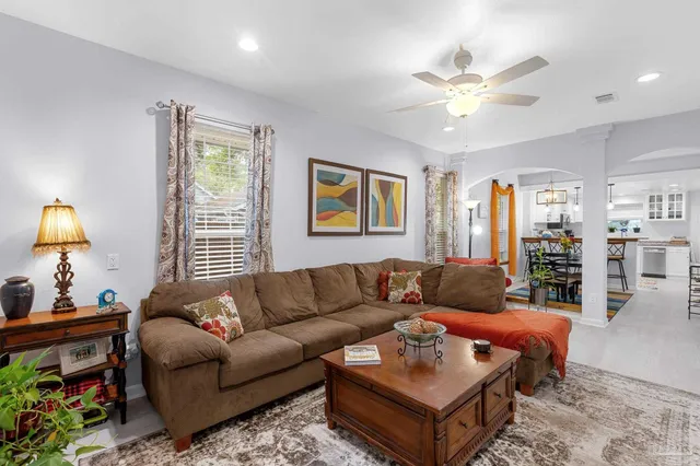a living room with furniture and a window
