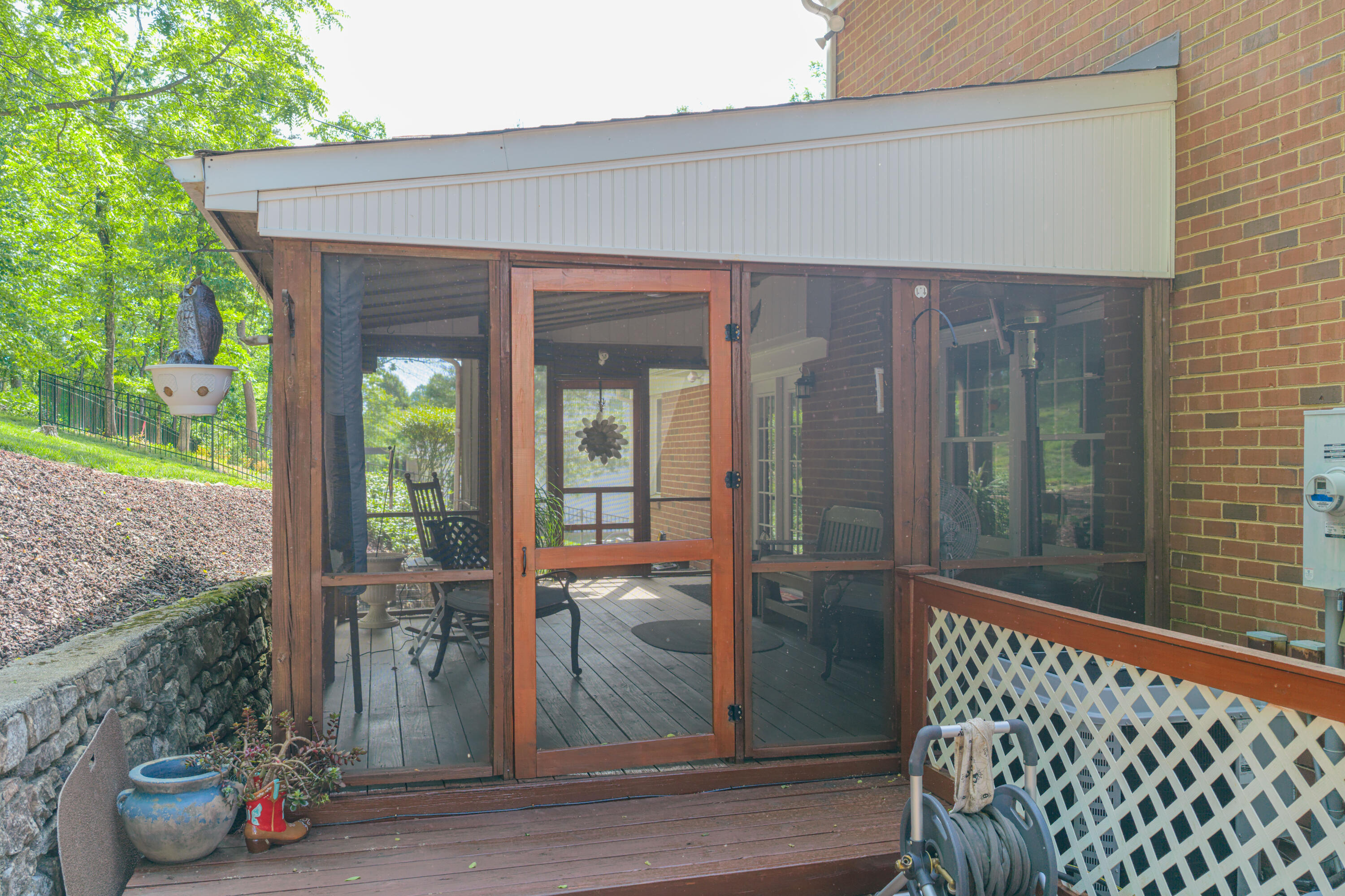 3341 Hidden Oak Road Southwest Roanoke, VA 24018 - Photo 5 of 26 a front view of a house with a glass door and glass door