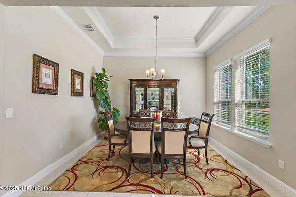 a view of a dining room with furniture window and outside view