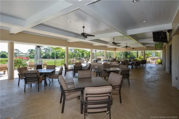 an aerial view of residential house with outdoor space and swimming pool