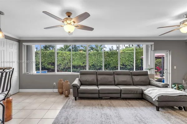 a living room with furniture and a large window
