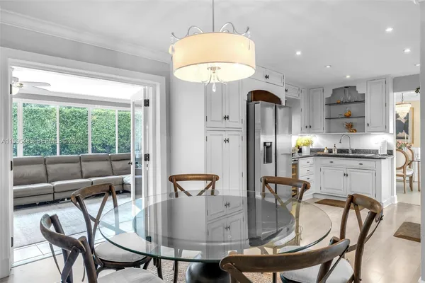 a dining room with furniture and window