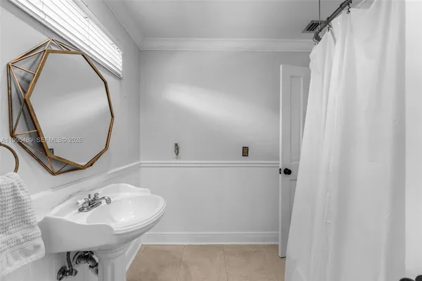 a bathroom with a sink a mirror and a toilet