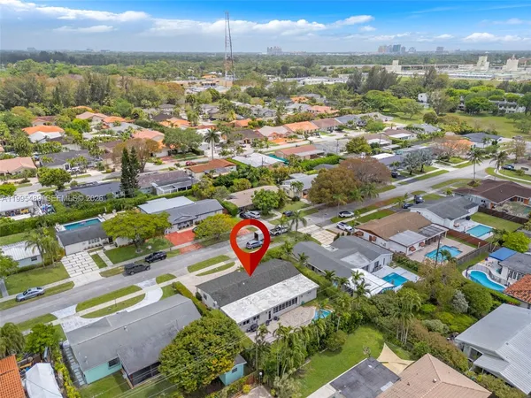 an aerial view of residential house with outdoor space