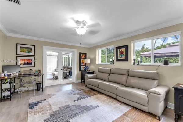 a living room with furniture and a large window