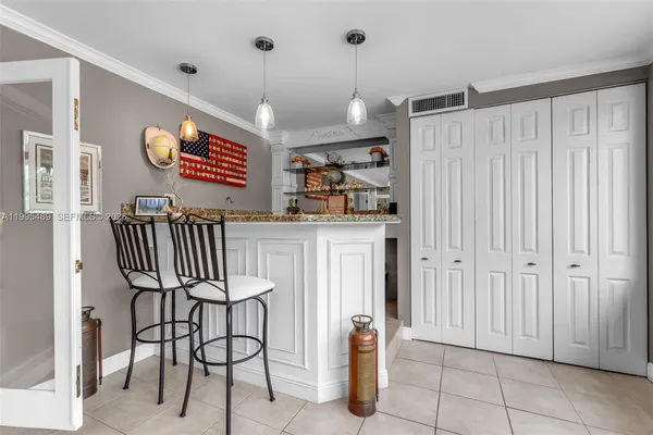 a view of a room with furniture and a chandelier