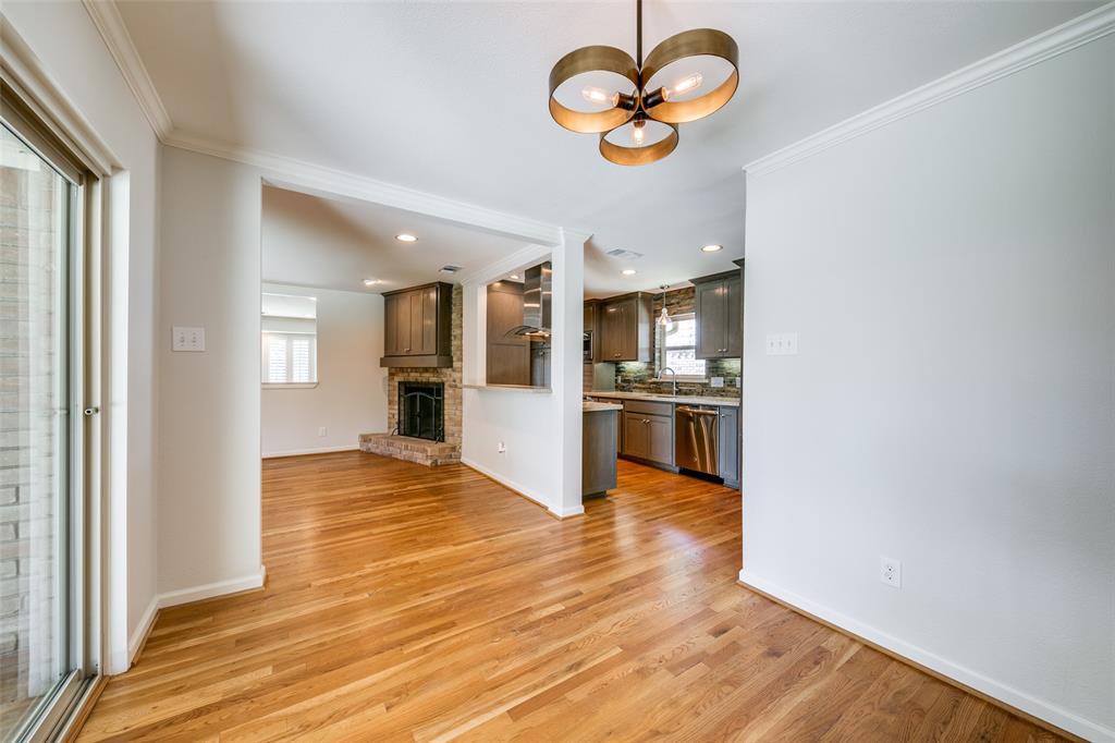6815 Santa Maria Lane Dallas, TX 75214 - Photo 13 of 24 an empty room with wooden floor and a window