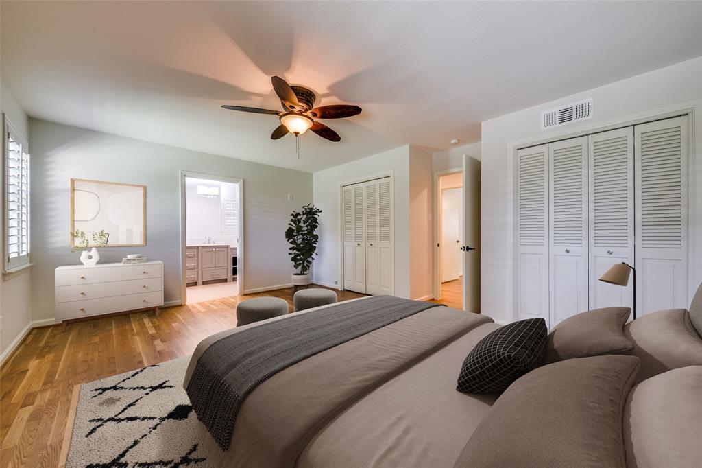 6815 Santa Maria Lane Dallas, TX 75214 - Photo 15 of 24 a bedroom with a bed couch and a window