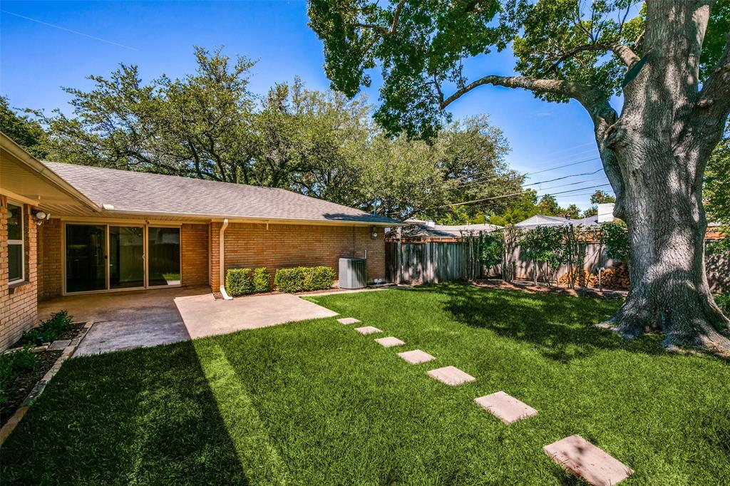 6815 Santa Maria Lane Dallas, TX 75214 - Photo 22 of 24 a view of a house with a yard