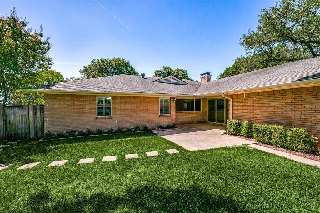 6815 Santa Maria Lane Dallas, TX 75214 - Photo 23 of 24 a front view of a house with a yard