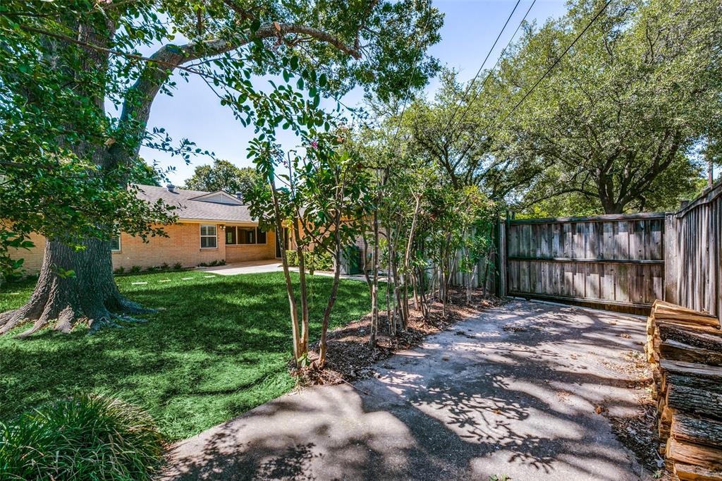 6815 Santa Maria Lane Dallas, TX 75214 - Photo 24 of 24 a view of a backyard with a tree