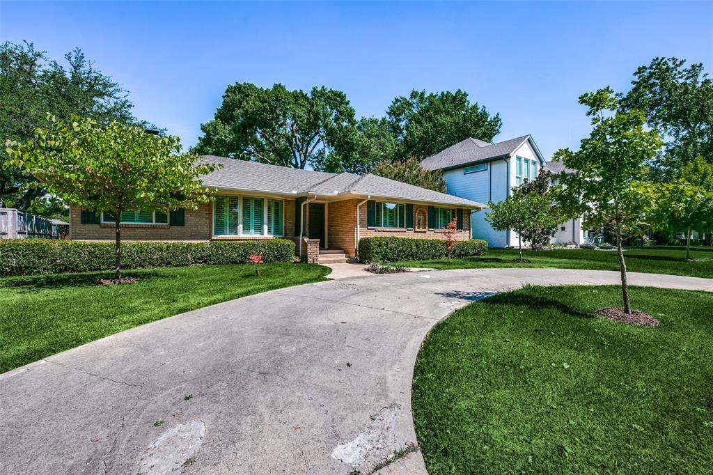 6815 Santa Maria Lane Dallas, TX 75214 - Photo 3 of 24 a house with green field in front of it