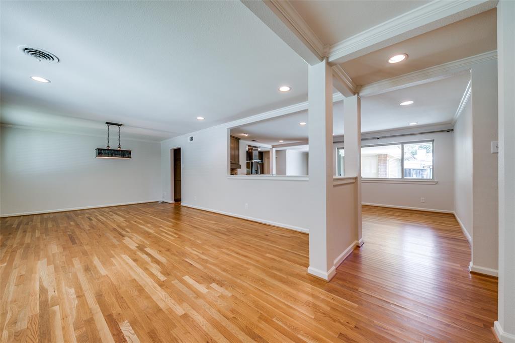 6815 Santa Maria Lane Dallas, TX 75214 - Photo 8 of 24 a view of empty room with wooden floor and windows